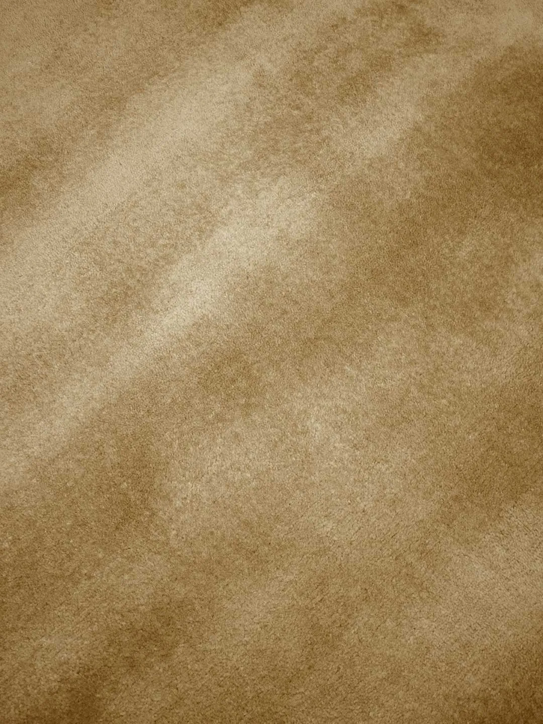 Close-up of cashmere-caramel rug pile showing fine fiber softness at 15mm pile height